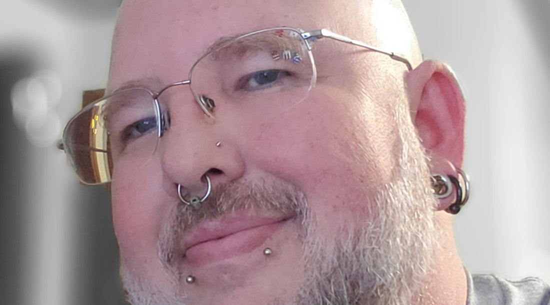 An image of my septum piercing with a captive bead septum ring in it.