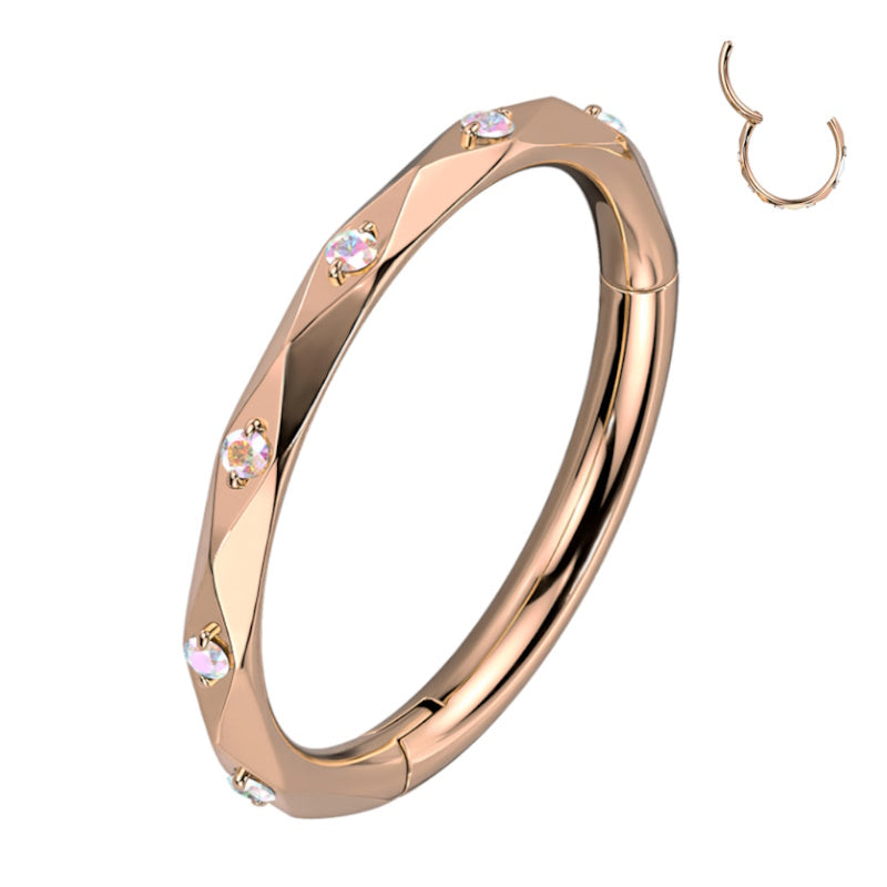 A titanium 16g rose gold septum ring featuring cubic zirconia accented diamond faceted cuts pictured against a white background.