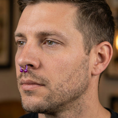 Horseshoe Circular Barbell Septum Ring 16 Gauge Acrylic in the septum piercing of a male model.