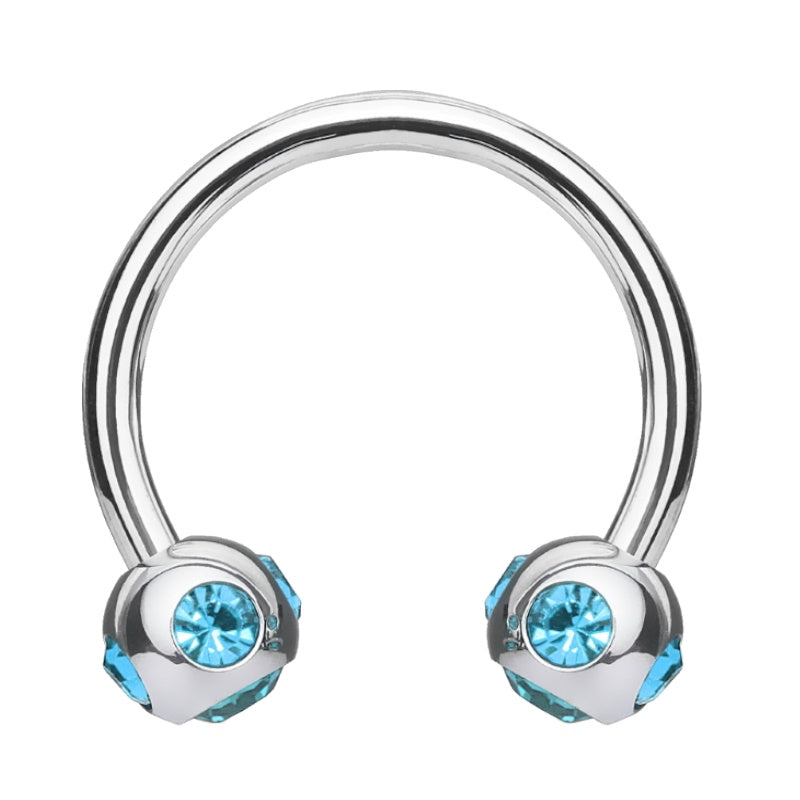 An aqua gem septum ring featuring a horseshoe design with a ball on each end that houses 5 aqua gems pictured against a white background.