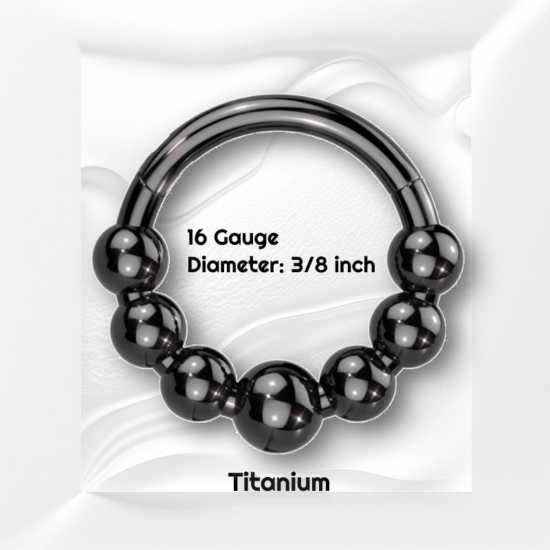 A black bead septum ring pictured against a white wavy background and text showing the size of the jewelry in black.