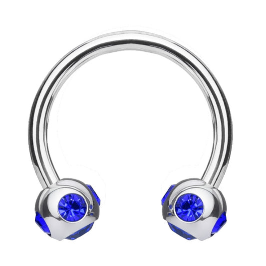 A blue gem septum ring with a horseshoe shape and a ball on each end featuring 5 blue gems pictured against a white background.