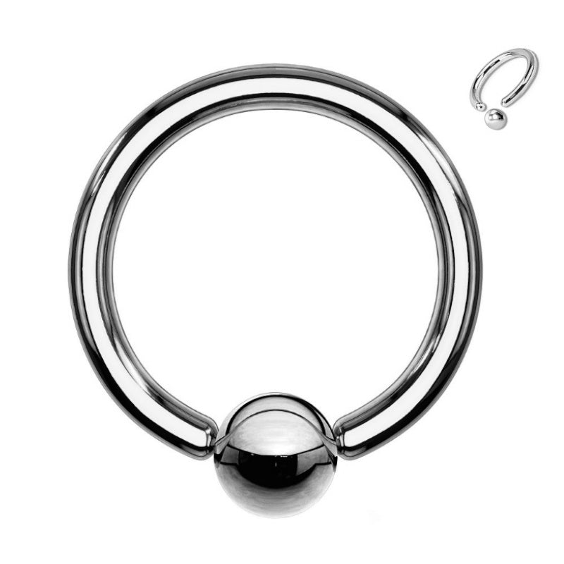 A captive bead titanium septum ring featuring a captive ball pictured against a white background.