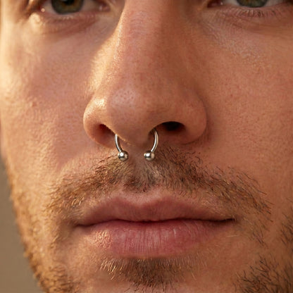 Circular Barbell Septum Ring 316L Surgical Steel Internally Threaded pictured in the septum piercing of a male model.