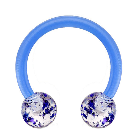 A glitter blue septum ring in a horseshoe design with a ball on each end pictured against a white background.