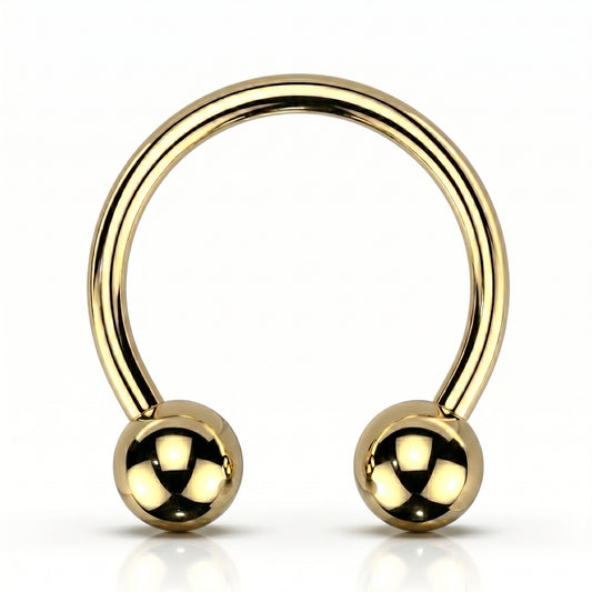 A gold PVD horseshoe septum ring circular barbell pictured against a white background.