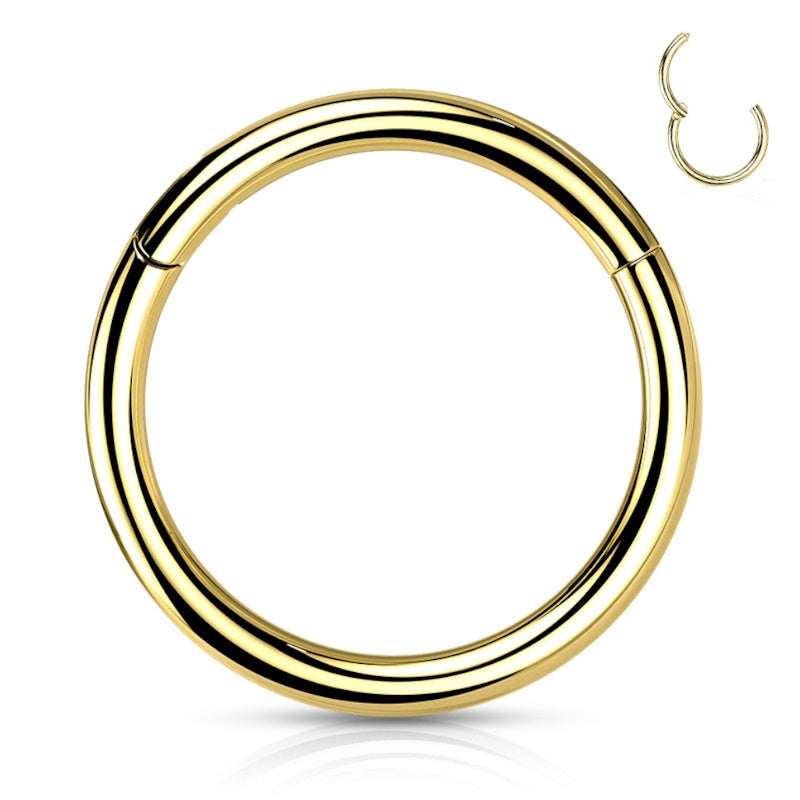 A gold titanium septum ring with a clicker design closure pictured against a white background.