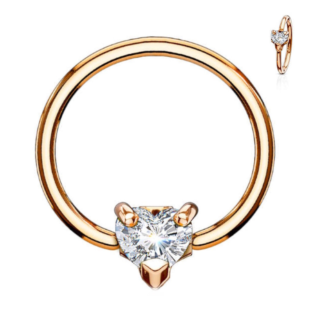 Heart CZ Captive Bead Septum Ring 16 Gauge 316L Surgical Steel in rose gold with a clear cubic zirconia pictured against a white background.