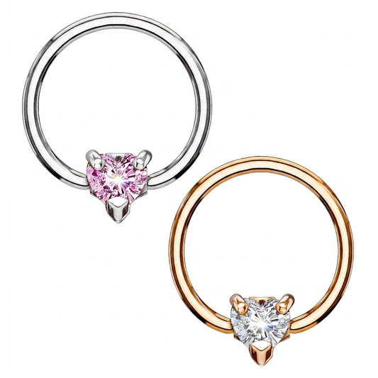 Heart CZ Captive Bead Septum Ring 16 Gauge 316L Surgical Steel One in silver with pink CZ and one in Rose Gold with a clear CZ pictured on a white background.