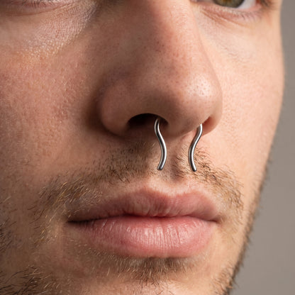 Omega Design Septum Retainer 316L Surgical Steel pictured in the septum piercing of a male model.