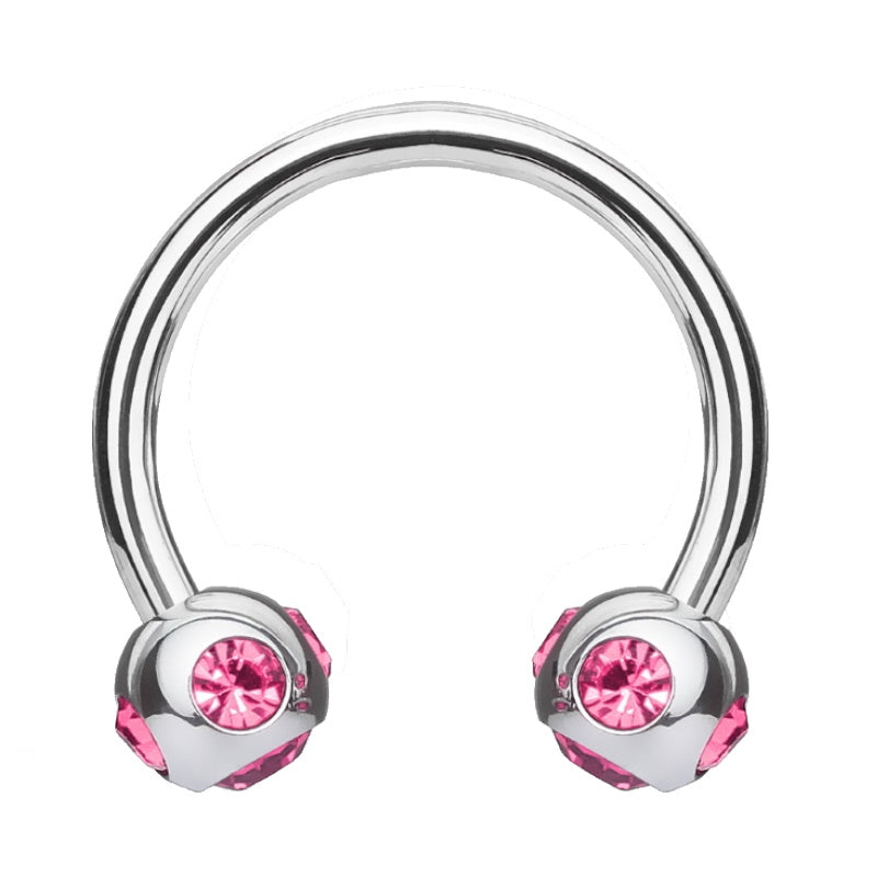 A pink gem septum ring in a horseshoe shape with 5 gems in each of the balls on the ends of the horseshoe pictured against a white background.