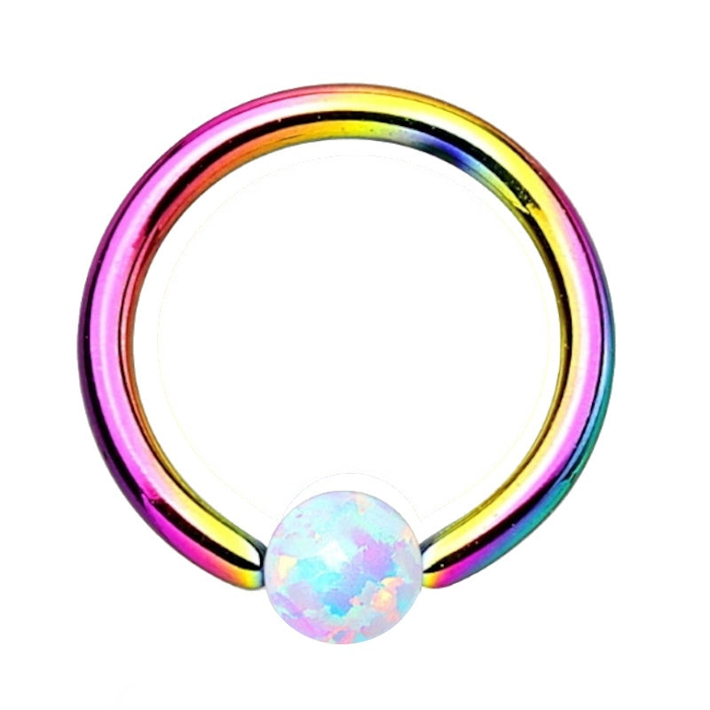 A rainbow opal captive septum ring with a rainbow surgical steel ring and a synthetic captive opal pictured against a white background.