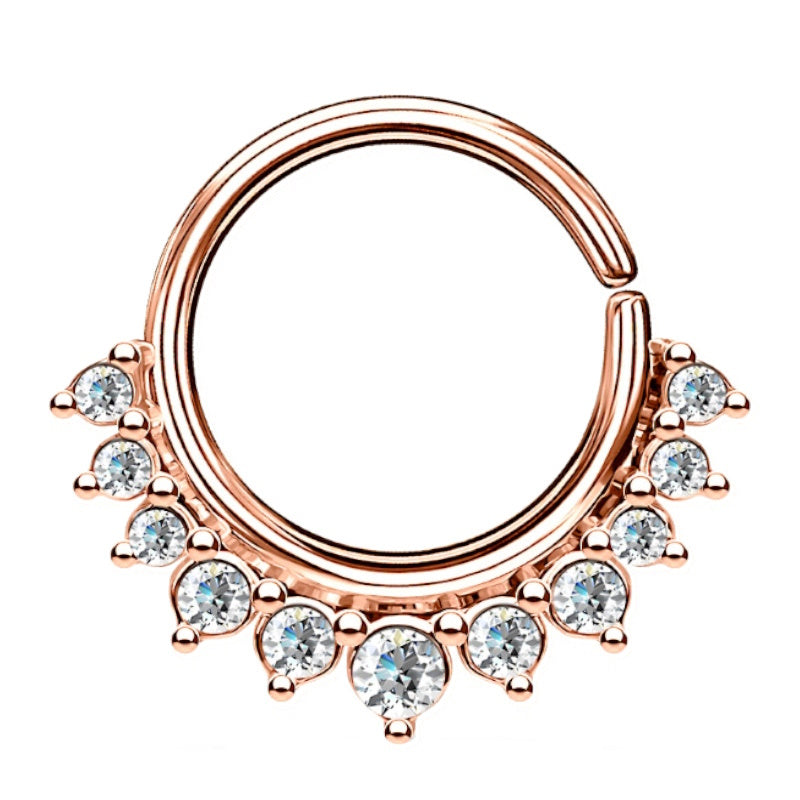 A rose gold crystal septum ring featuring a bendable hoop design with small crystals lining the bottom half of the hoop pictured against a white background.