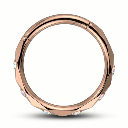 A Rose Gold Cubic Zirconia Segment Ring accented with diamond faceted cuts pictured against a white background.