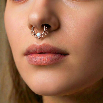 Rose Gold Filigree Opal Septum Clicker 16 Gauge 316L Surgical Steel pictured in the septum piercing of a female model.