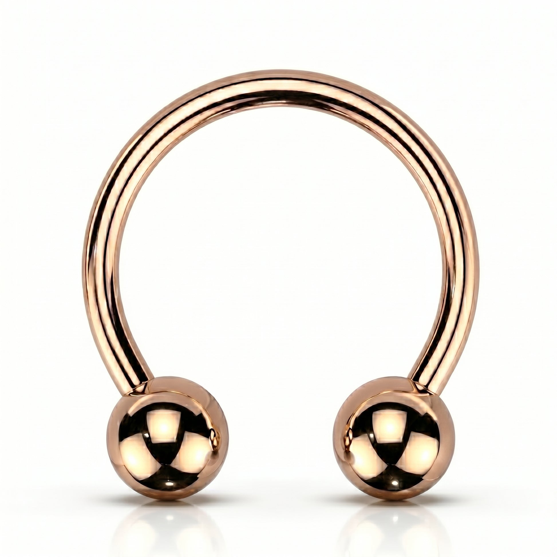 A rose gold horseshoe circular barbell septum ring that is internally threaded with a ball on each end of the horseshoe, pictured against a white background.