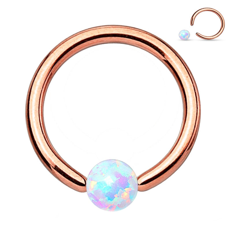 A rose gold opal captive septum ring featuring a rose gold ring with an opal captive bead pictured against a white background.