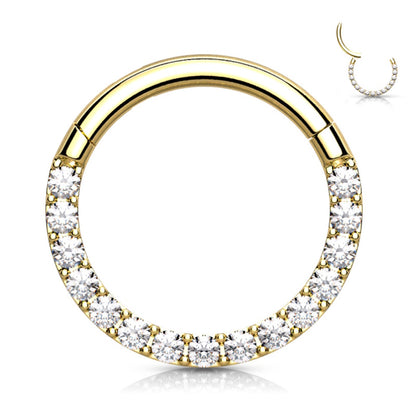 A gold plated surgical steel 18g segment ring featuring shiny cubic zirconia's along the bottom half pictured against a white background.