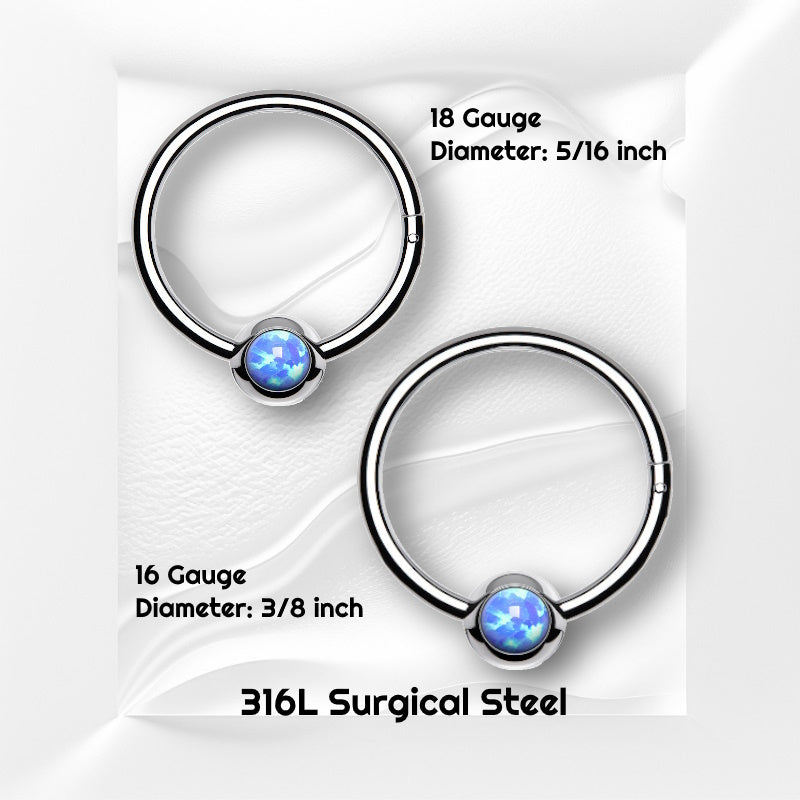 Two surgical steel opal septum rings pictured on a white wavy background with black text stating the size of these pieces of septum jewelry.