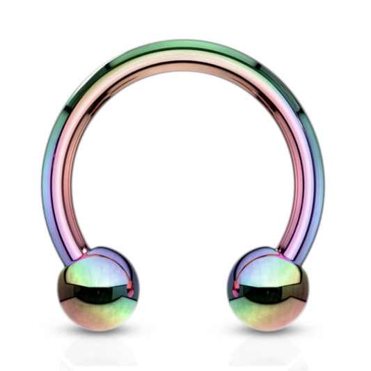 A surgical steel rainbow septum ring in a horseshoe shape with a ball on each end pictured against a white background.