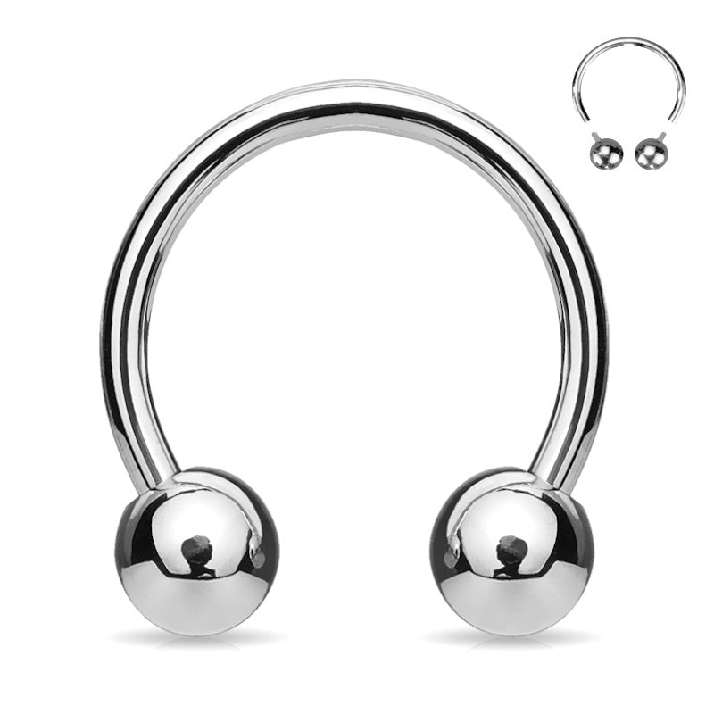 A 16 gauge surgical steel septum ring that is internally threaded with a ball on each end pictured against a white background.