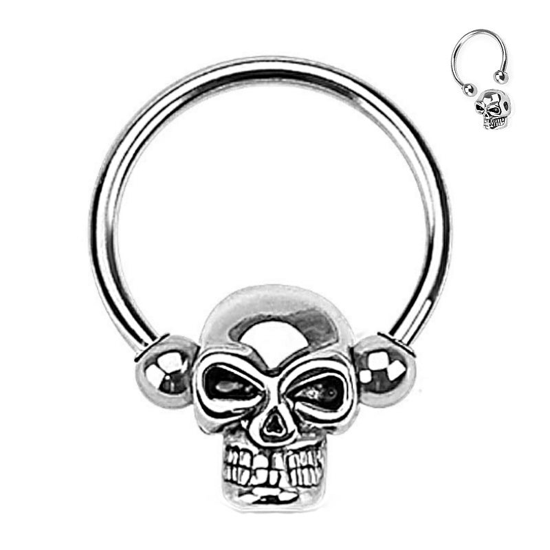 A surgical steel skull septum ring with a horseshoe design and a captive skull pictured against a white background.