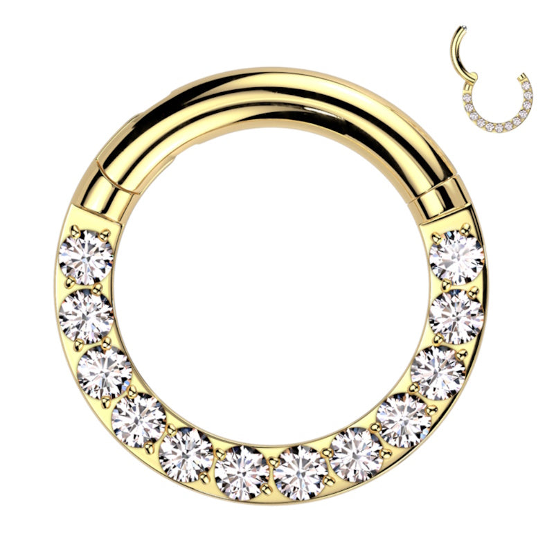 A titanium 12 gauge septum ring with a gold finish and cubic zirconia adornments pictured against a white background.