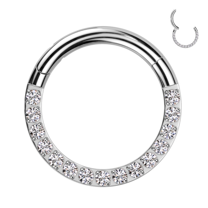 A titanium 14g septum ring with a clicker closure design and featuring cubic zirconia's on the bottom half of the hoop pictured against a white background.