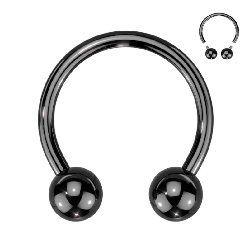 A titanium 8g septum ring with a black finish in a horseshoe shape with a ball on each end pictured against a white background. 