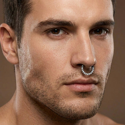 Close-up of a male model wearing a titanium black and cubic zirconia septum ring.
