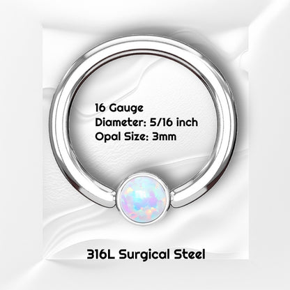 A white opal septum ring pictured on a white wavy background with black text stating the size of this piece of septum jewelry.